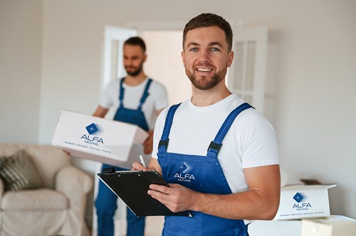 Two Alfa Moving moving crew people moving boxes with Alfa Moving logos out of a home
